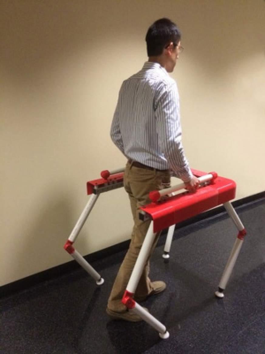 Image of a person using a robotic walker