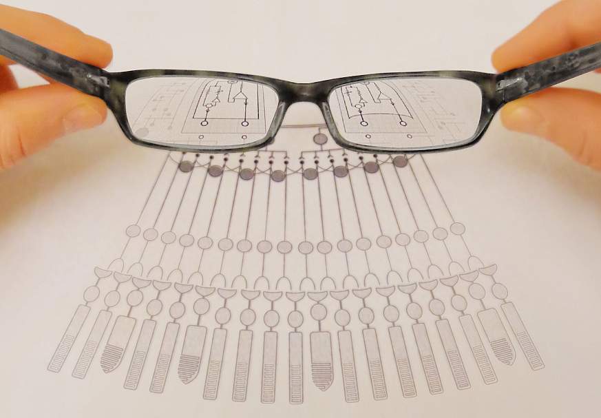 Image of glasses magnifying a diagram.
