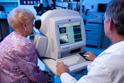 Patient undergoing OCT-examination of her retina.