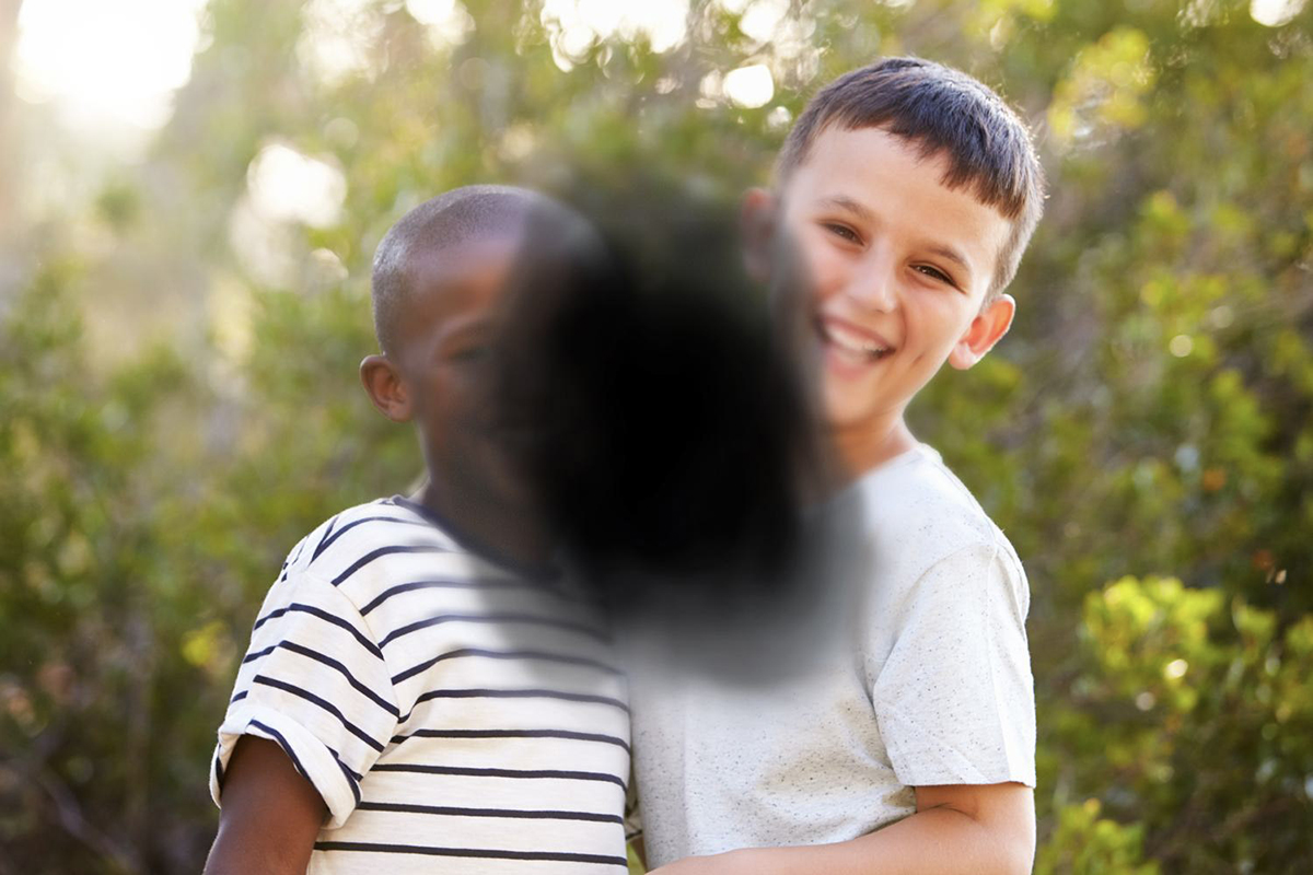 Two children with the center blacked out representing the loss of central vision caused by age-related macular degeneration