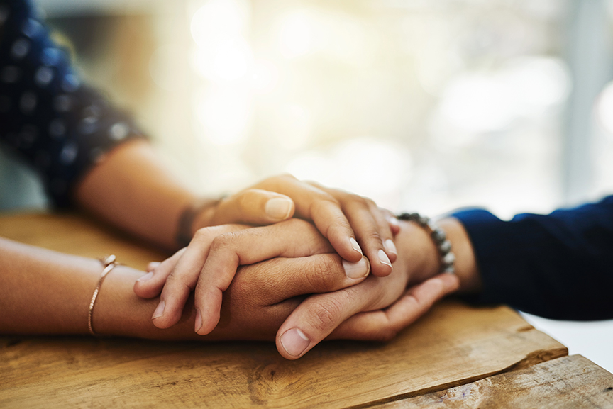 Couple holding hands.