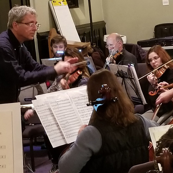 Braunstein conducts the Me2 Orchestra.