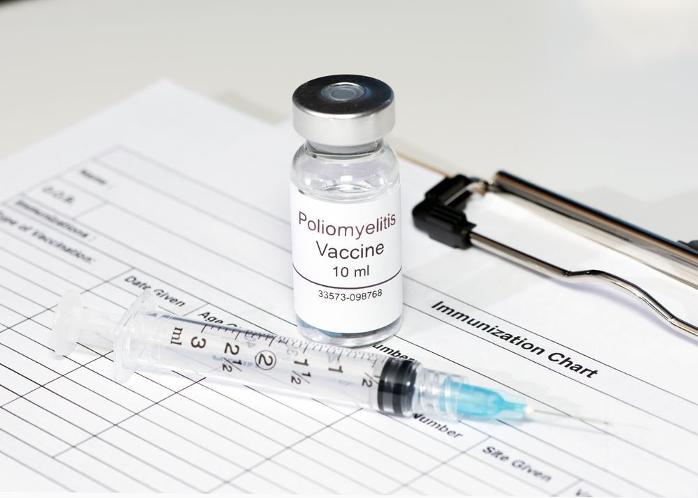 Polio vaccine on patient immunization chart with syringe. M