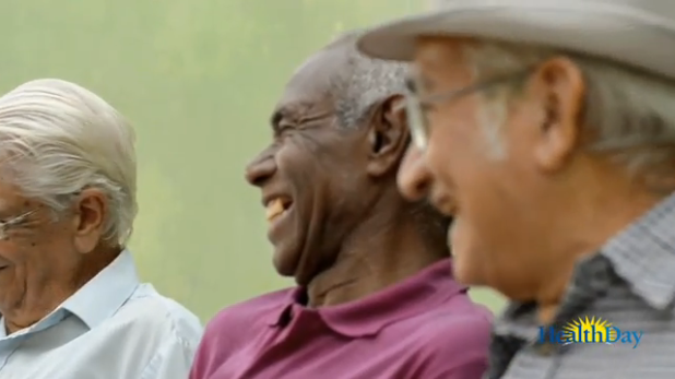 Video screenshot of three mature men talking together.