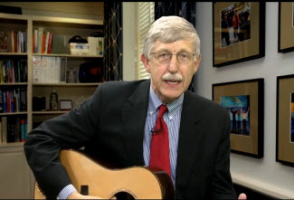 Dr. Collins playing his guitar.