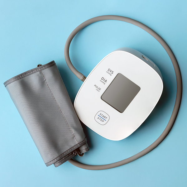 A blood pressure monitor on a blue background