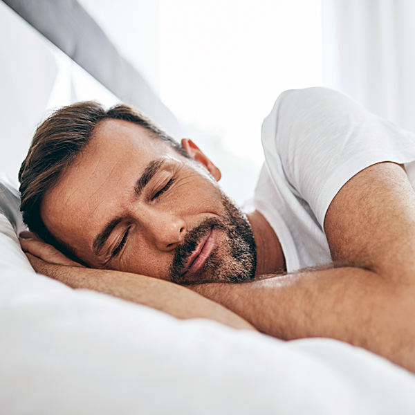 A man sleeping in bed