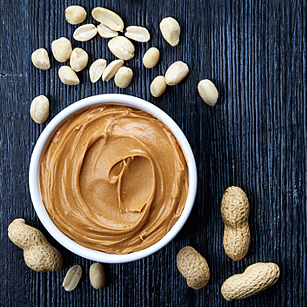 Peanuts and a bowl of peanut butter