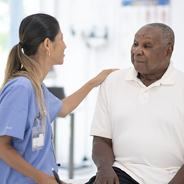 A senior African American man talking to his doctor