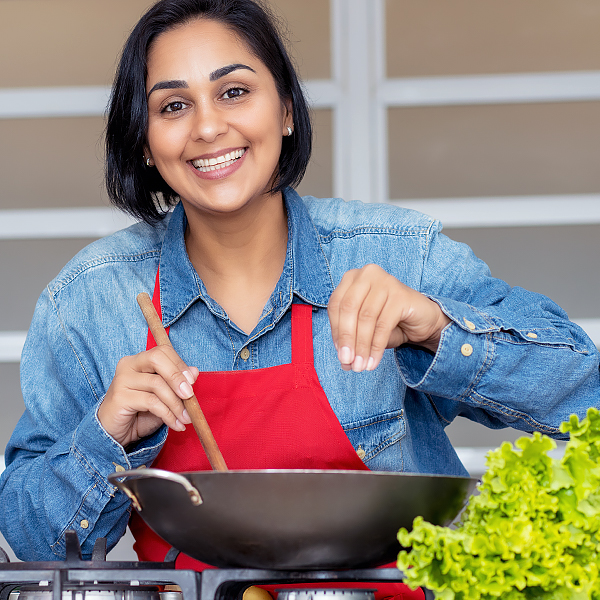A woman cooking a healthy meal