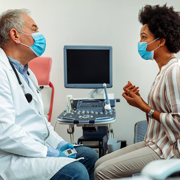 A woman talking to her doctor