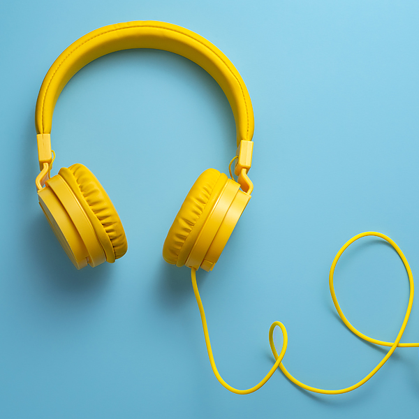 Yellow headphones on a blue background