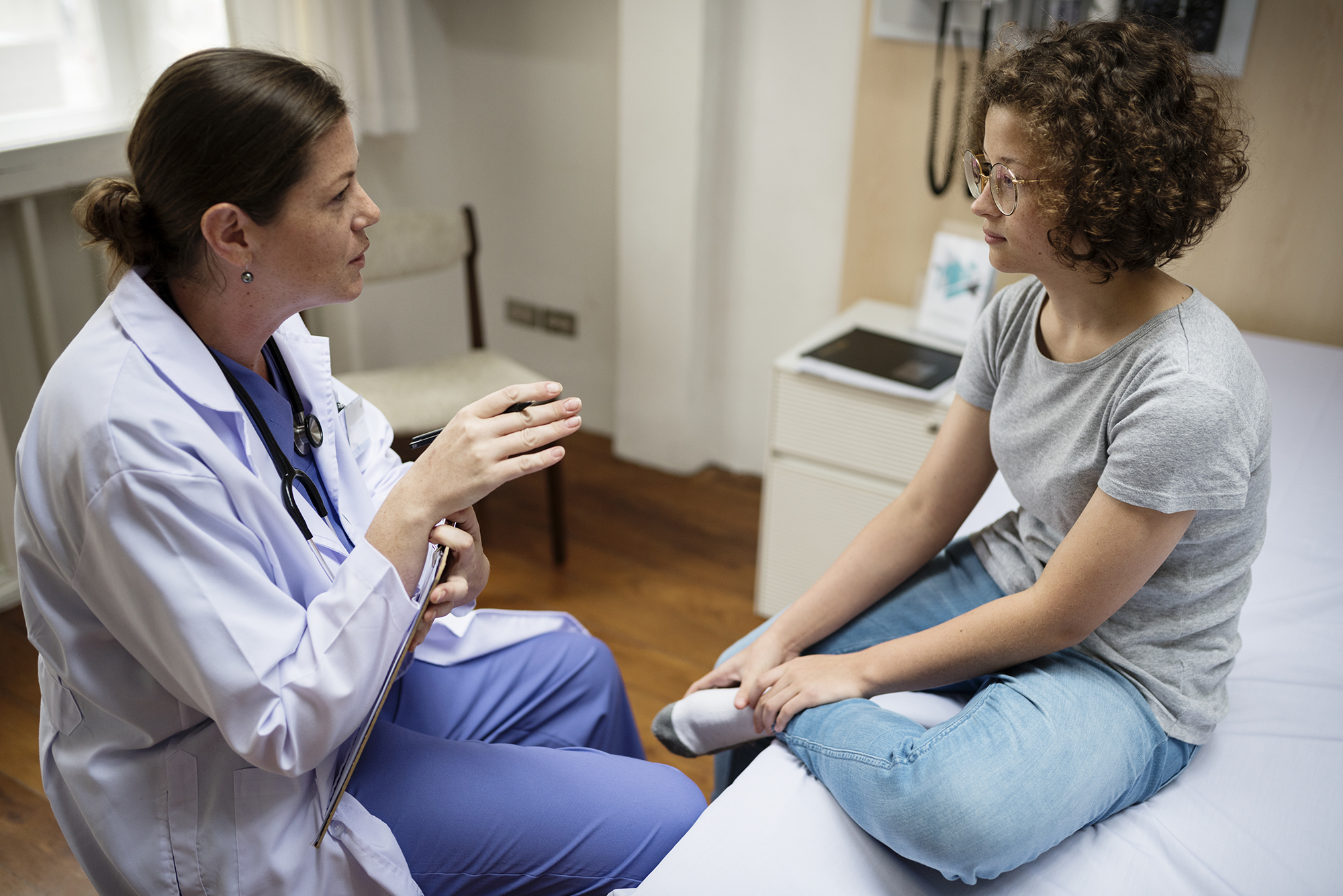 A woman talking with her doctor.