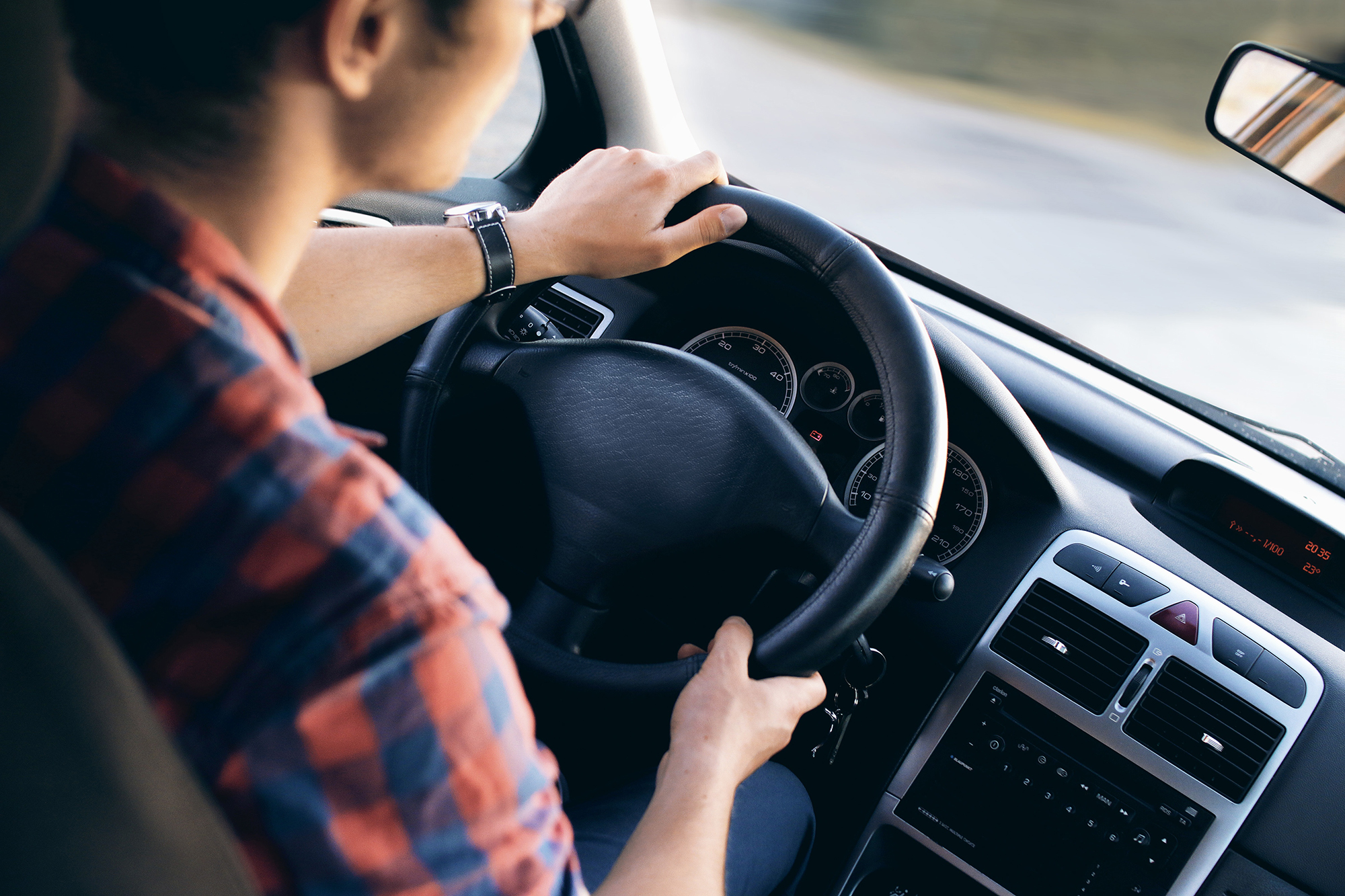 Image of a teen driving a car