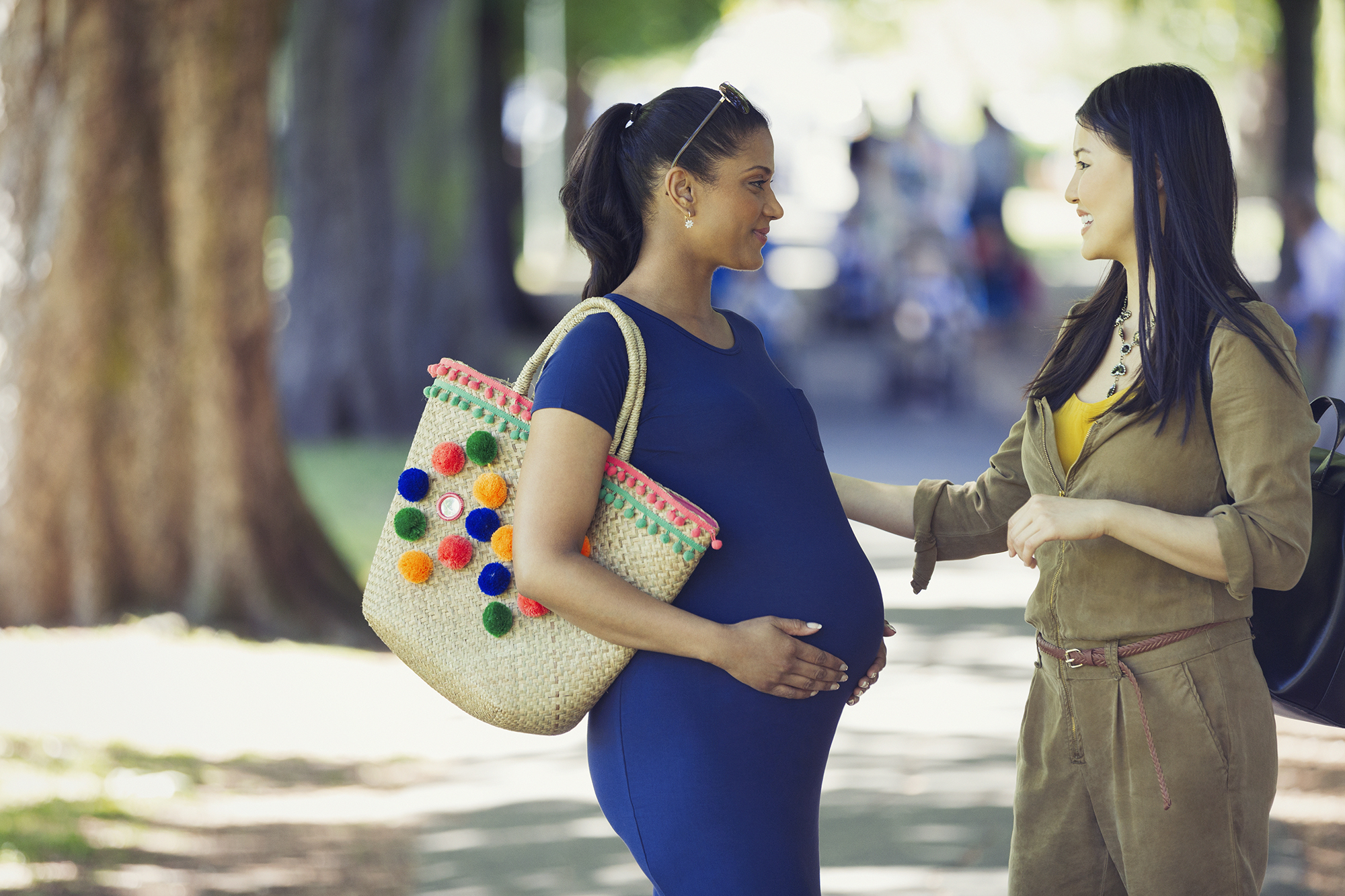 A pregnant woman in the park