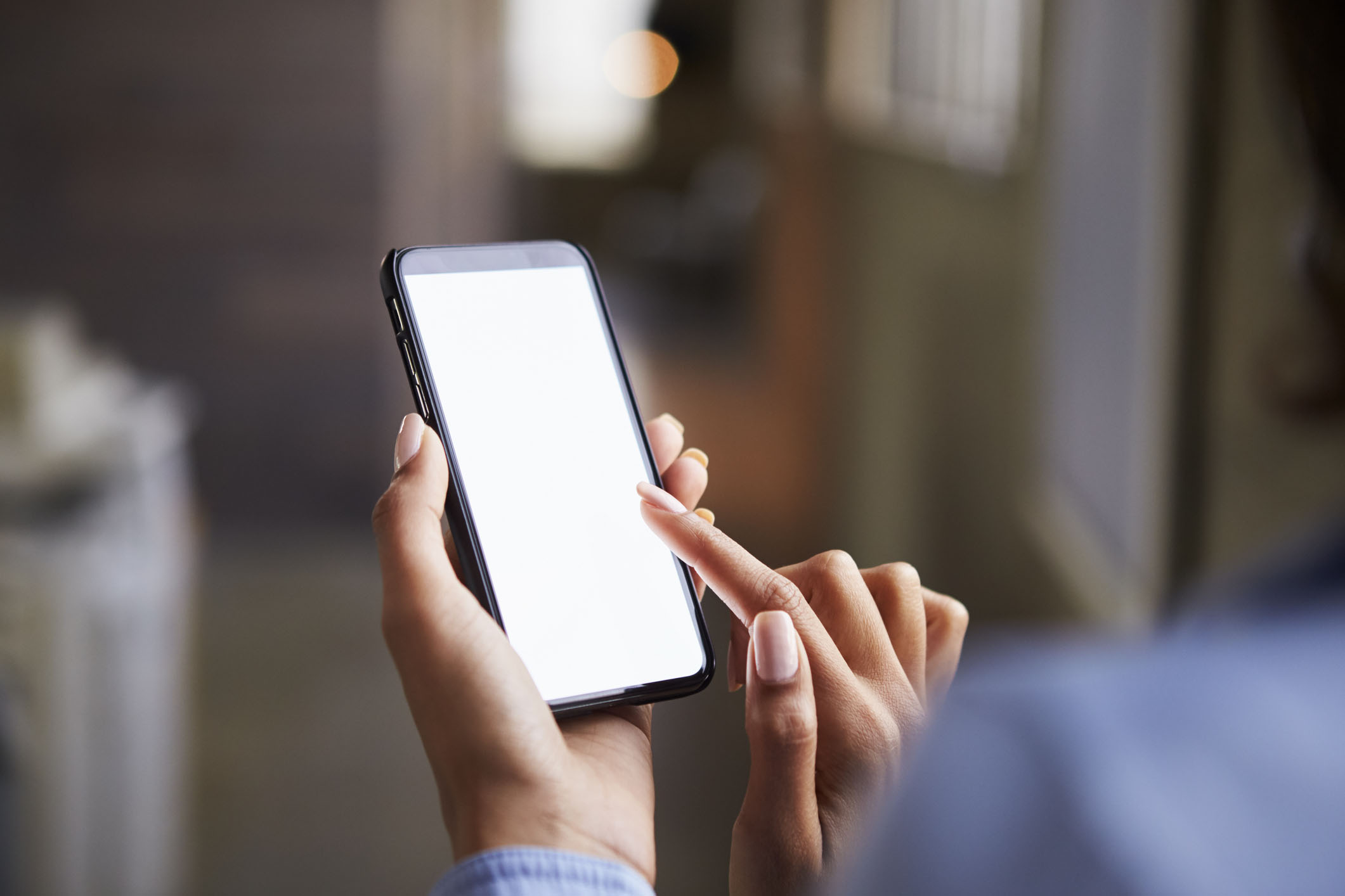 A hand holding a phone.