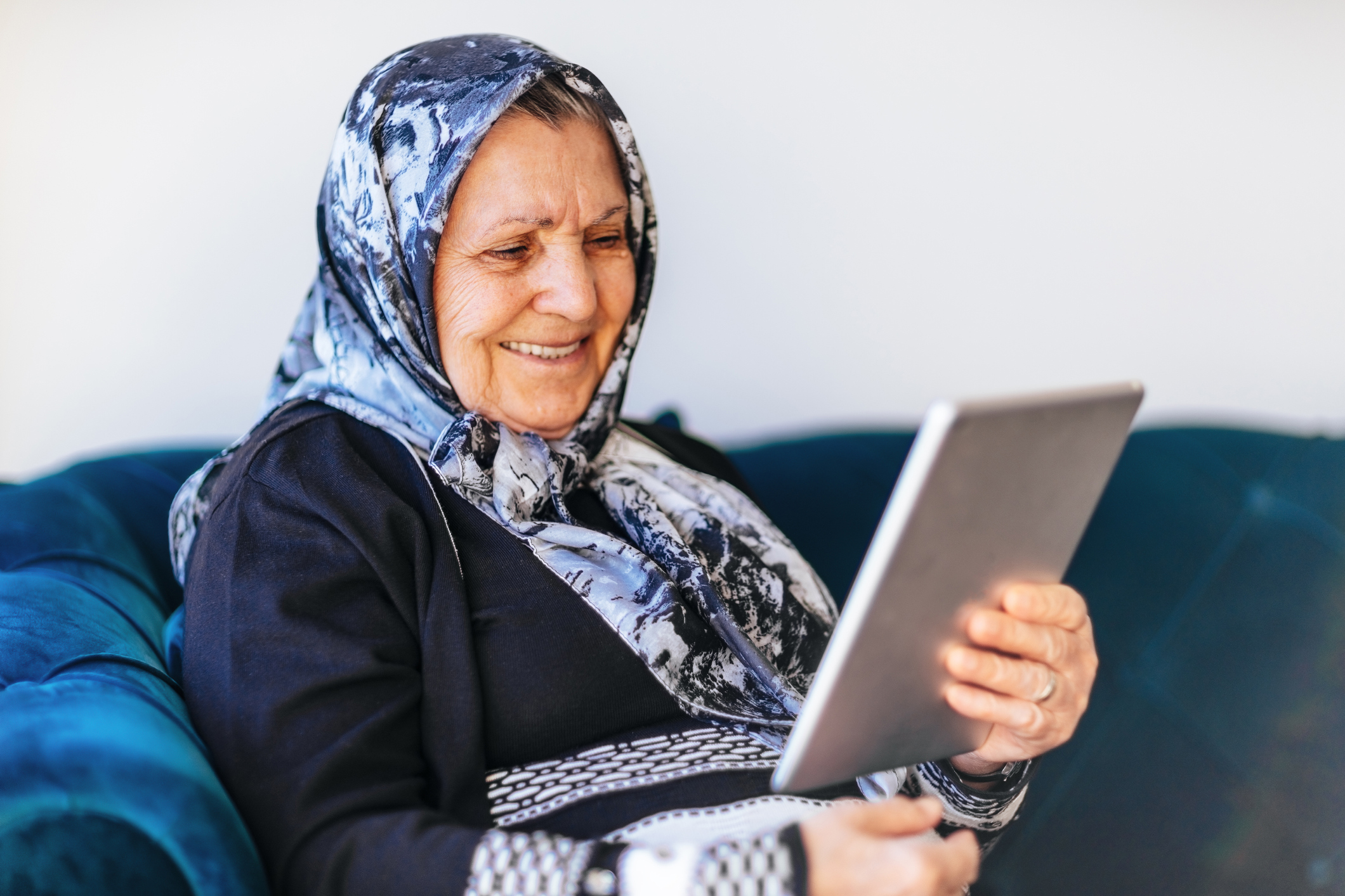Older woman looking at a tablet