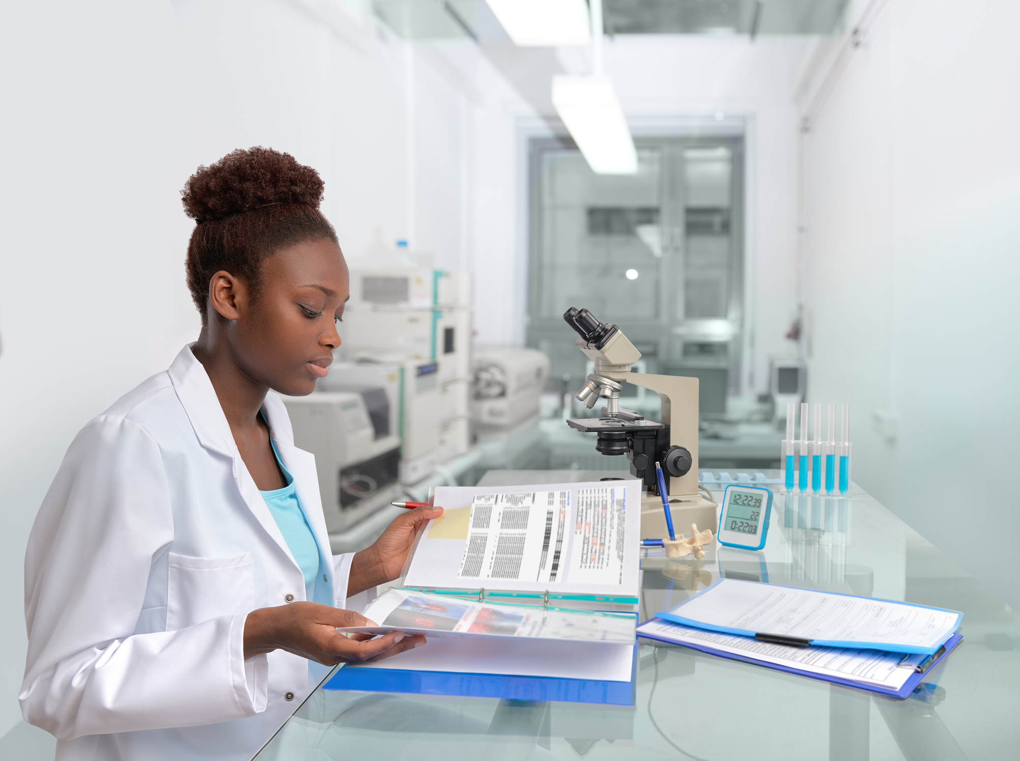 African scientist, medical worker, tech or graduate student works in modern biological laboratory