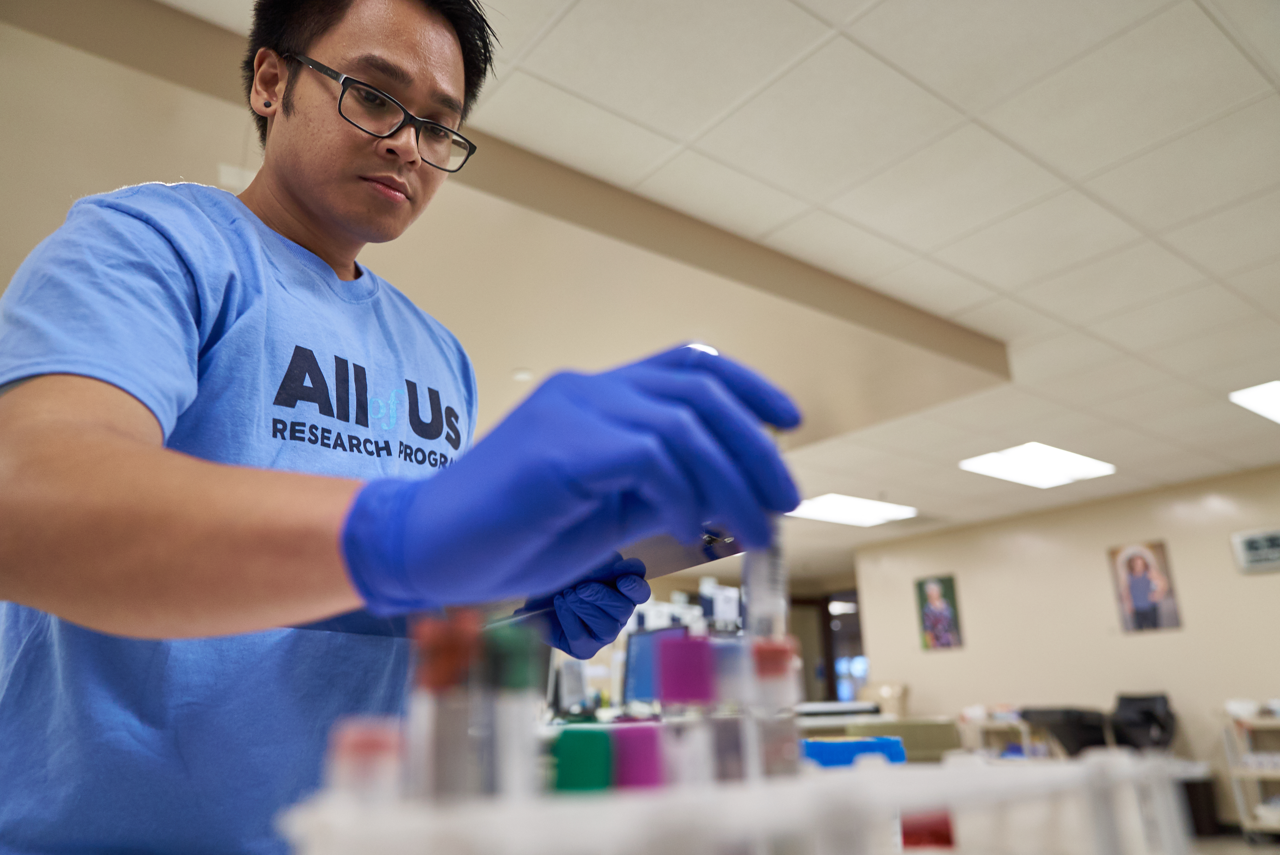 Image of a man and test tubes.