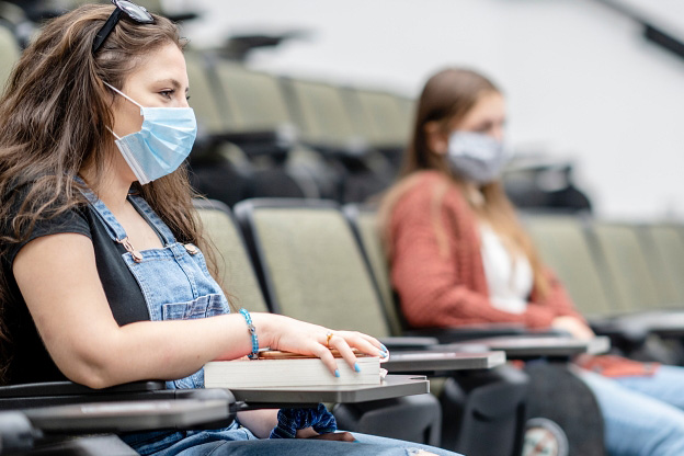 College students wearing masks on campus.