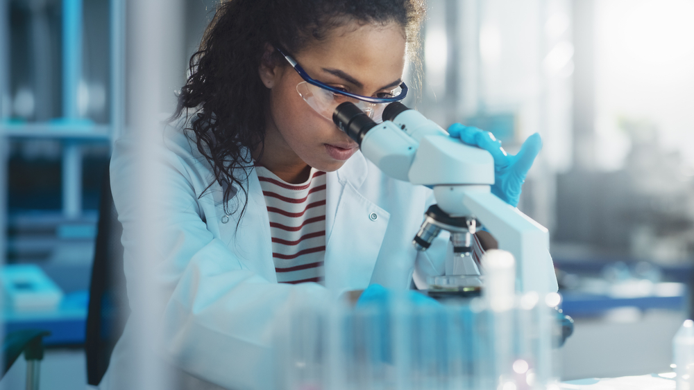 Researcher sits in lab