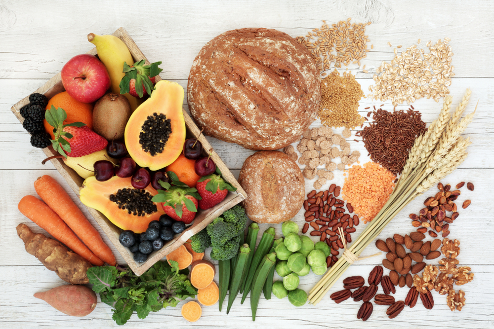 Healthy high fibre diet food concept with legumes, fruit, vegetables, wholegrain bread, cereals, grains, nuts and seeds. Super foods high in antioxidants, anthocyanins, omega 3 and vitamins. Healthy high fibre diet food concept with legumes, fruit, vegetables, wholegrain bread, cereals, grains, nuts and seeds. Super foods high in antioxidants, anthocyanins, omega 3 and vitamins.
