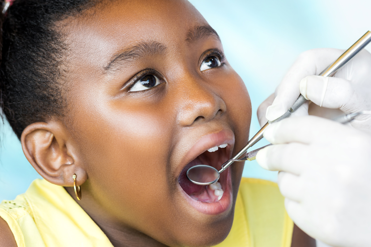 Image of a girl receiving a dental exam