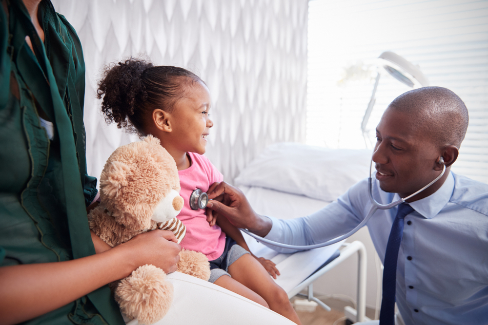 Image of a doctor examining a child