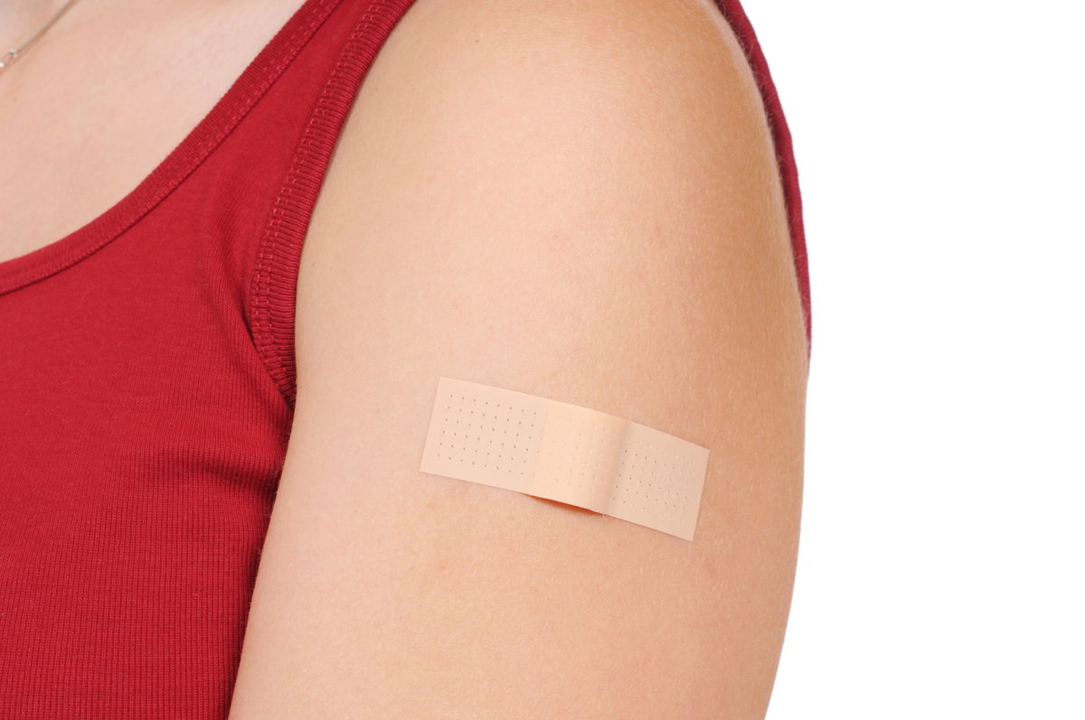 Woman wearing a bandaid.