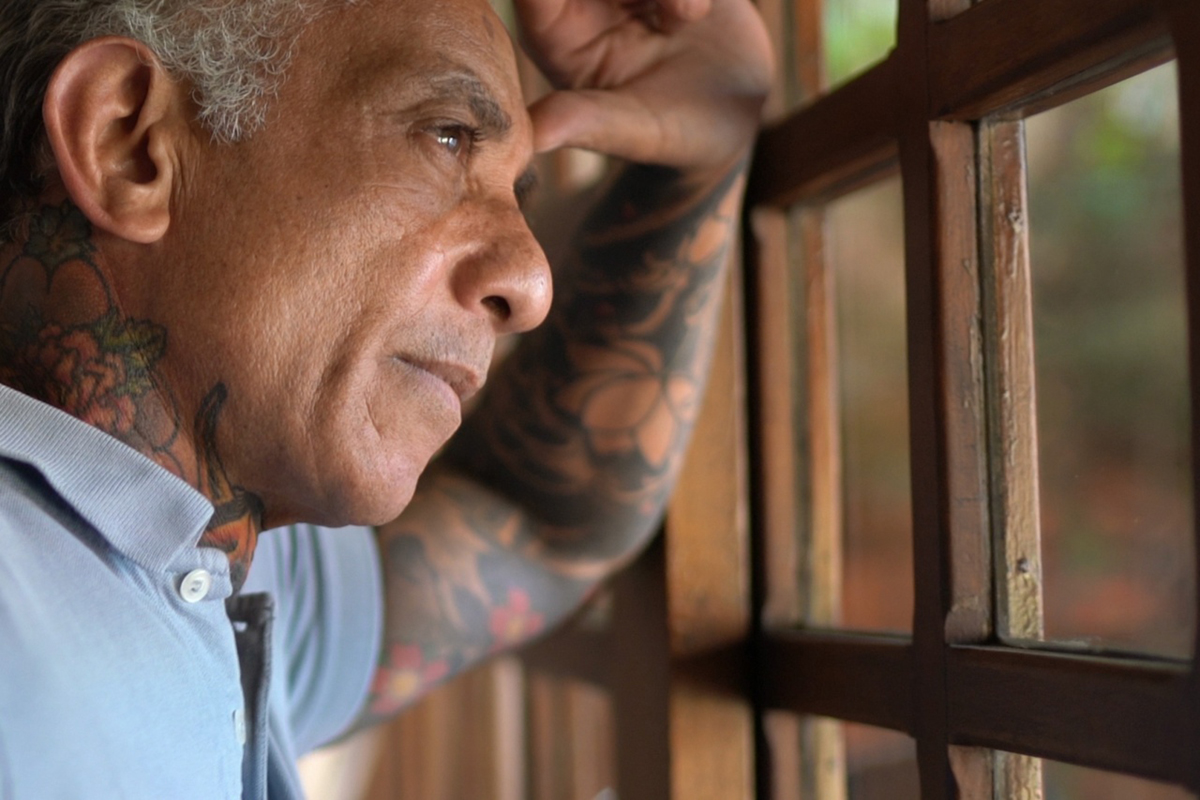 Close-up of a man looking out of a window.