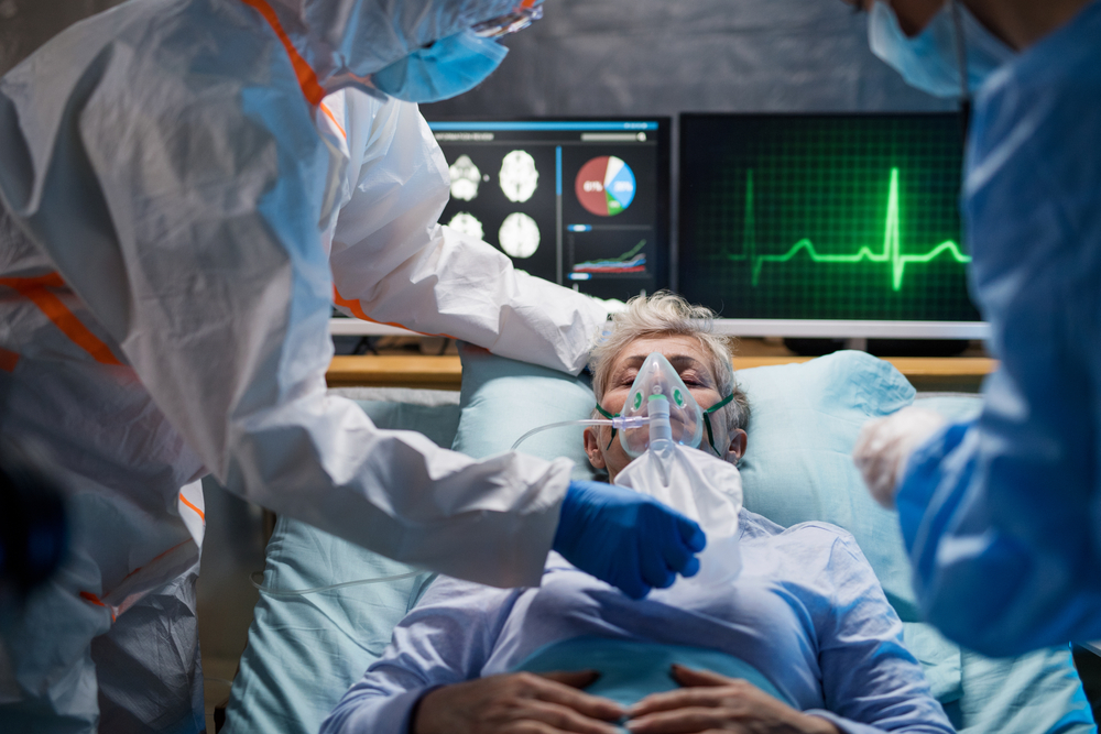 Infected patient in quarantine lying in bed in hospital