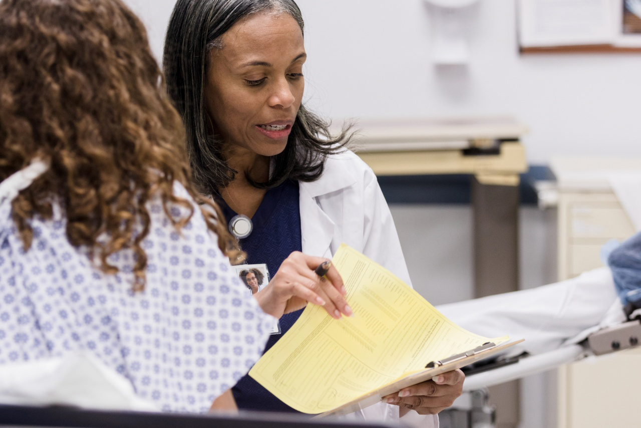 Doctor discussing care with a patient in the emergency room