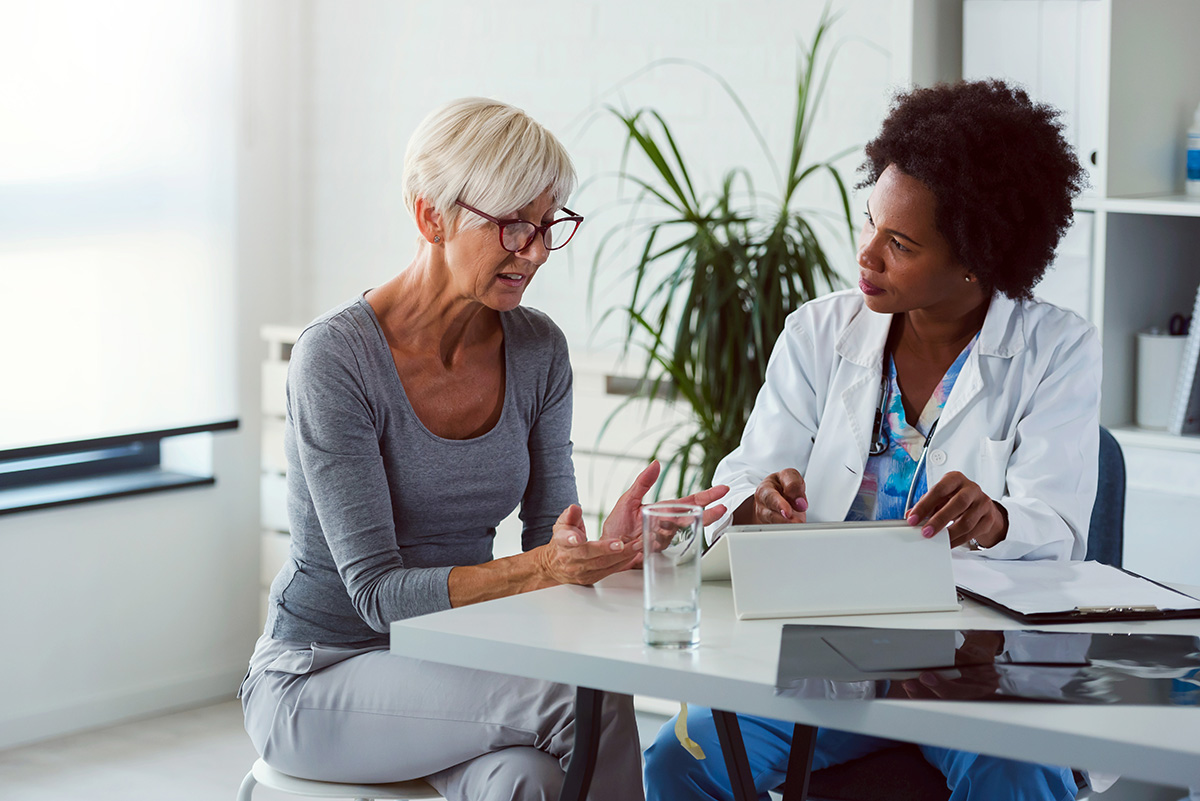 Image of a woman talking to her doctor