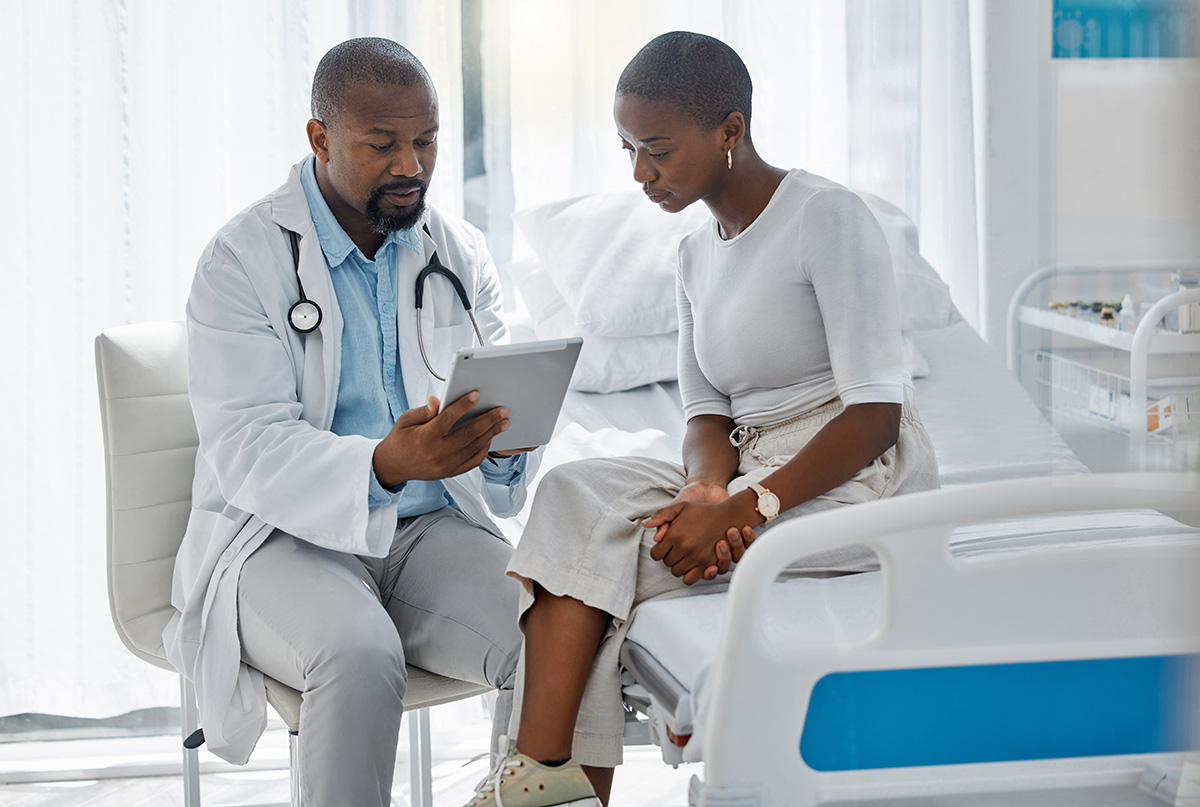 Image of a woman talking with her doctor.