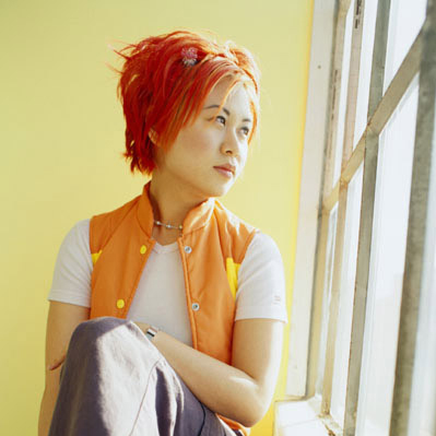 Photo of a teenage girl gazing out the window - Cropped