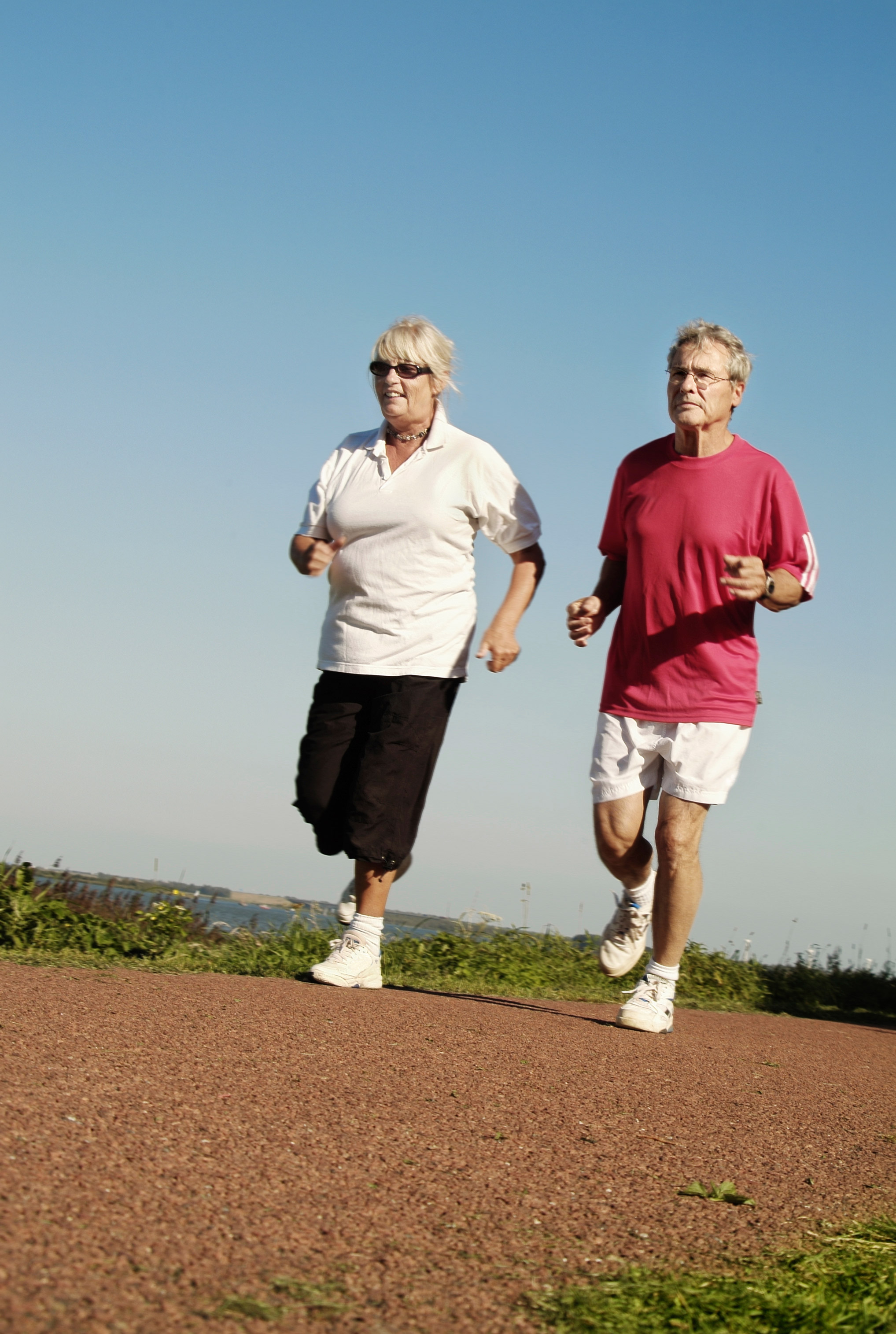 a photo of a man and a woman jogging