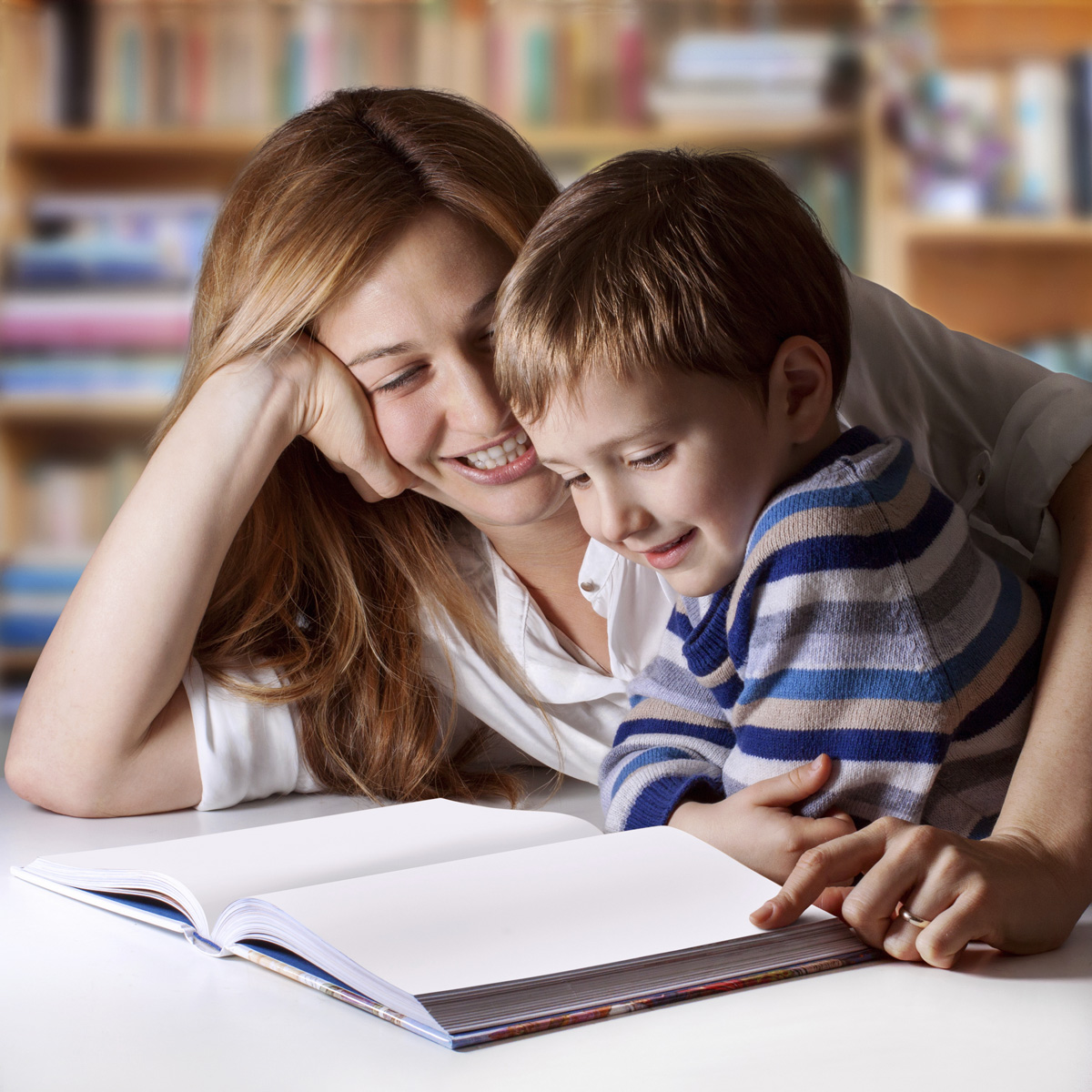 A mother and young son enjoying reading time.