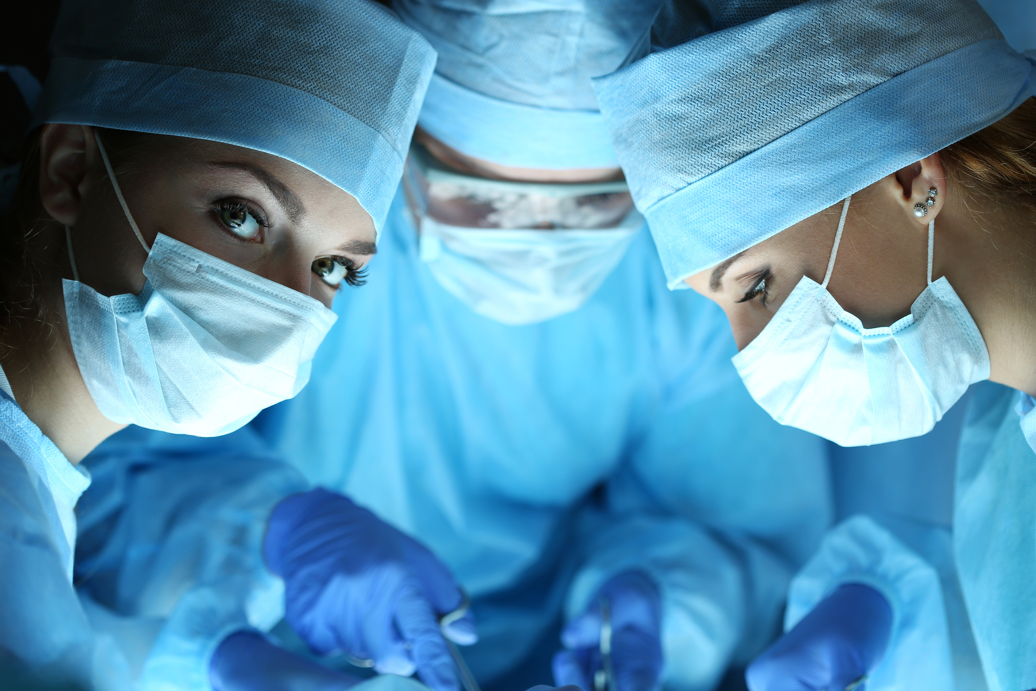 Doctors performing surgery Doctors performing surgery