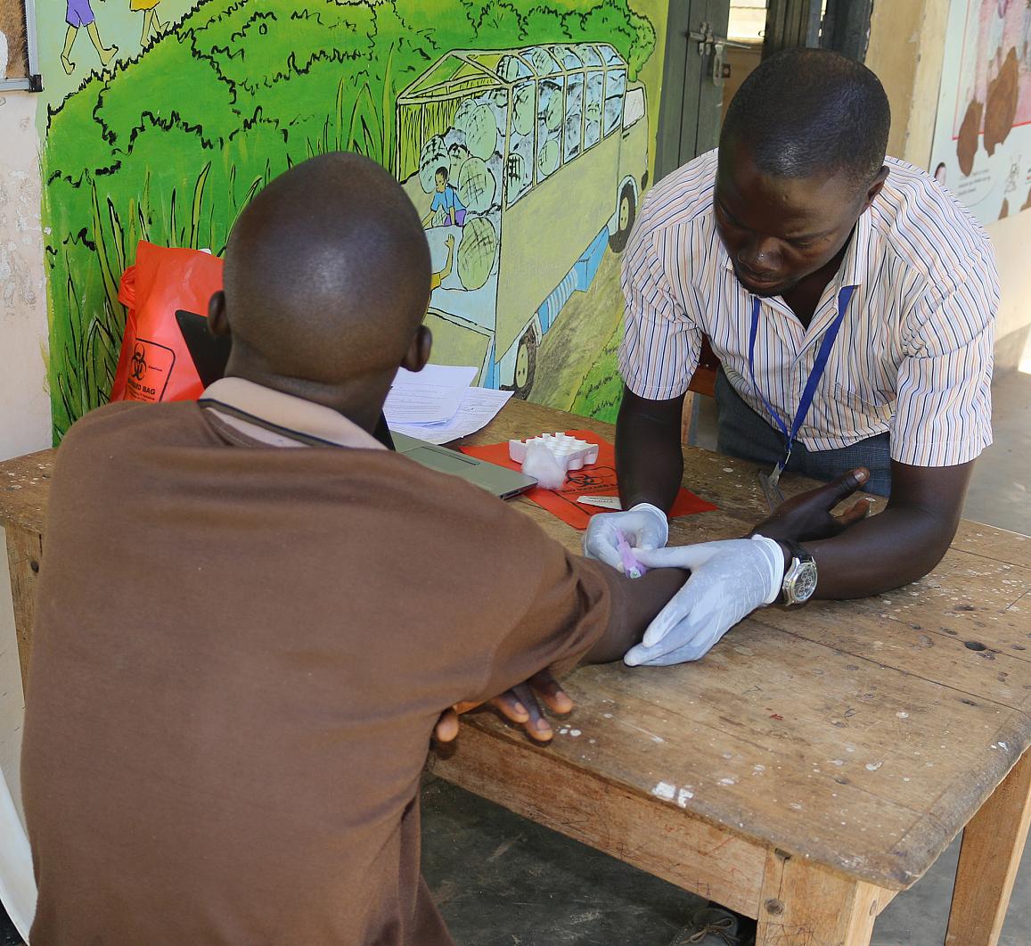 Drawing blood from a study participant