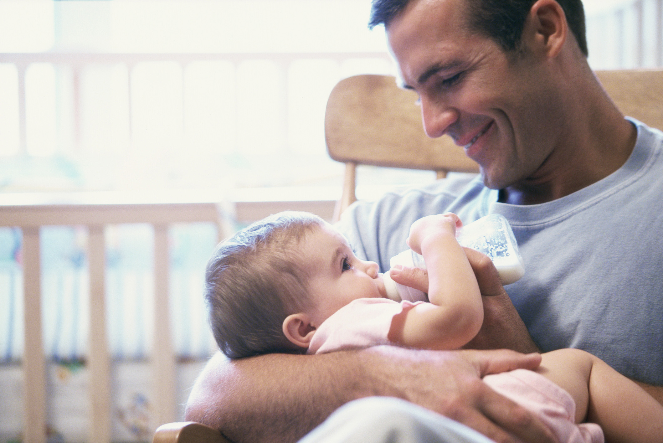 Father feeding a baby boy