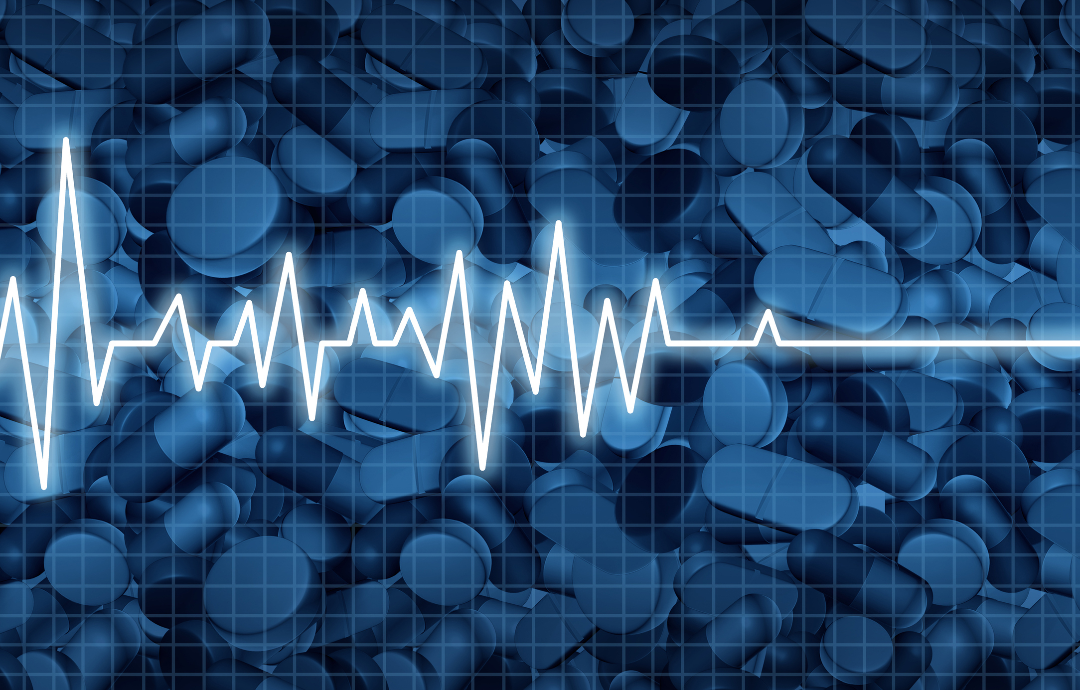 Illustration of an electrocardiogram of cardiac arrest on a background of pills