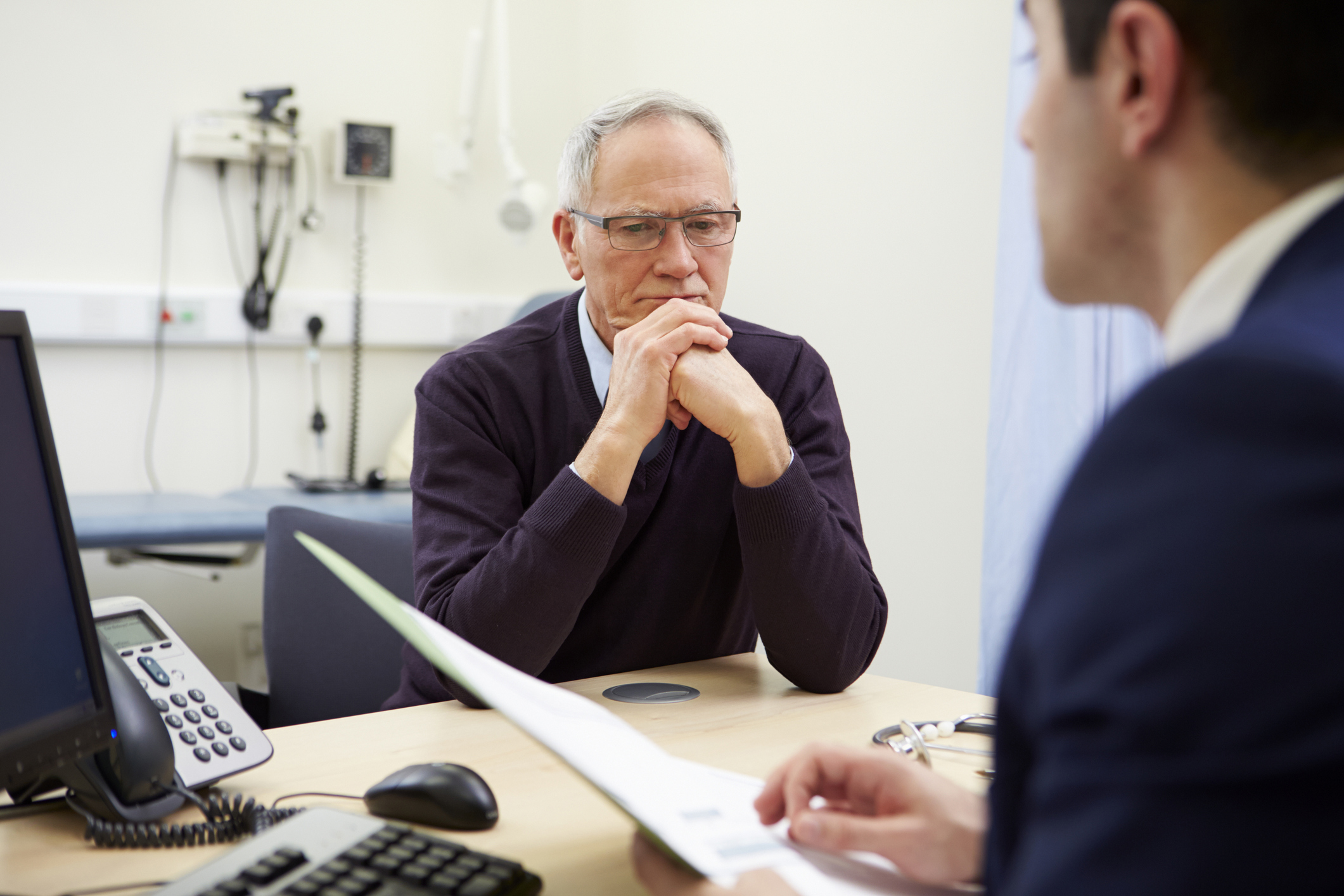 Doctor discussing test results with concerned patient