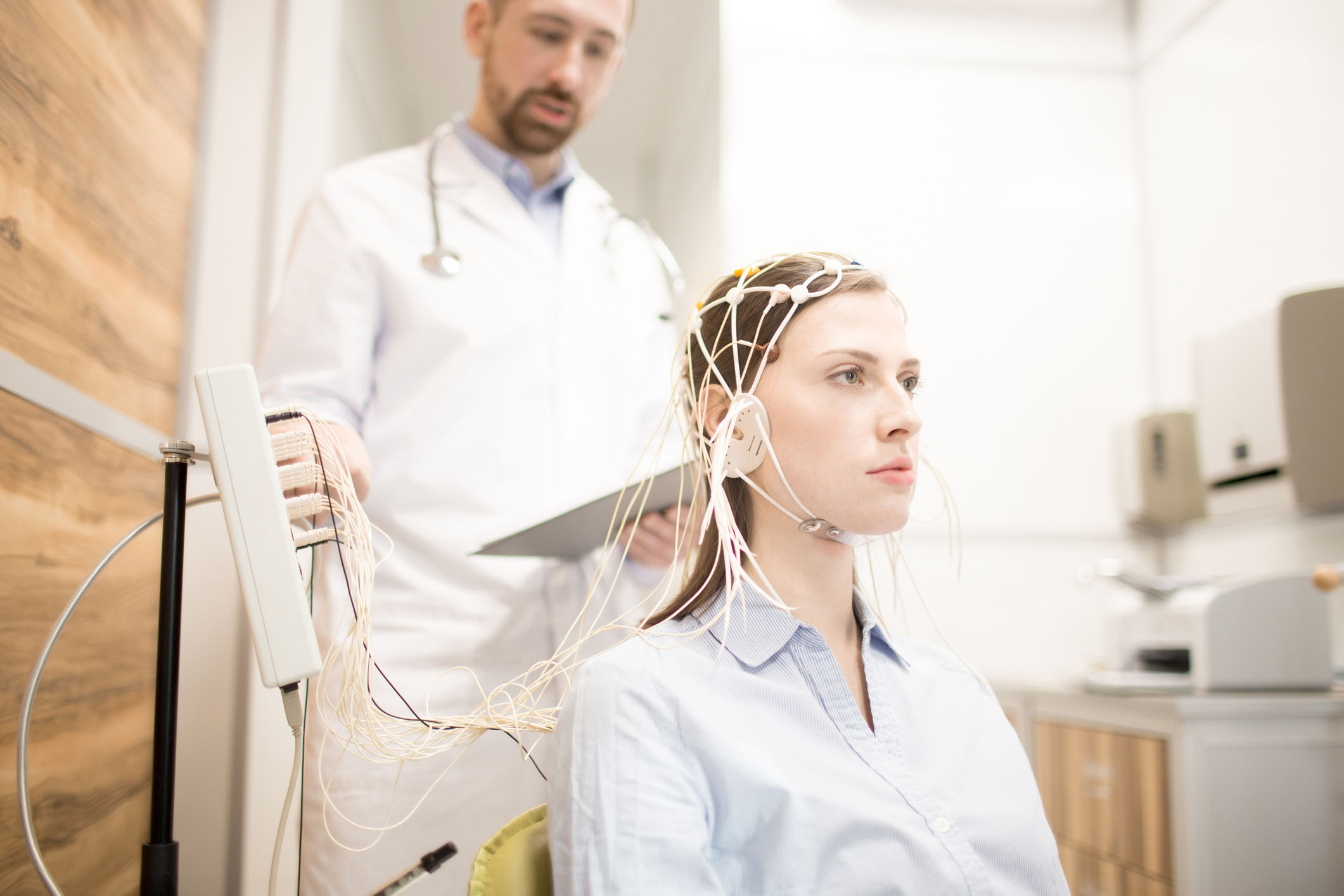 Young woman undergoing electroencephalography