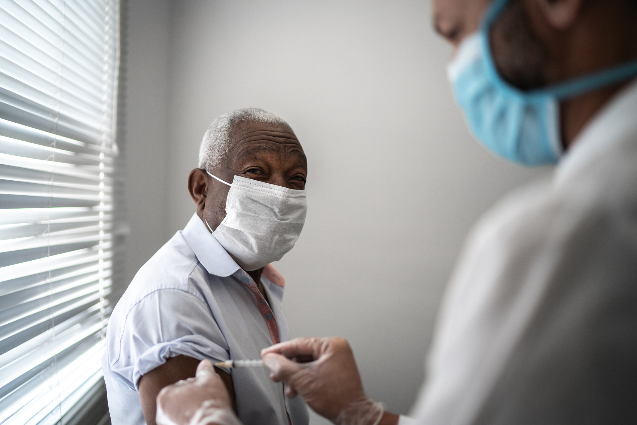 Mature black man getting vaccination