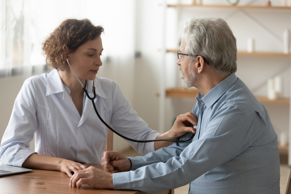 Doctor listening to a patient’s heart with a stethoscope