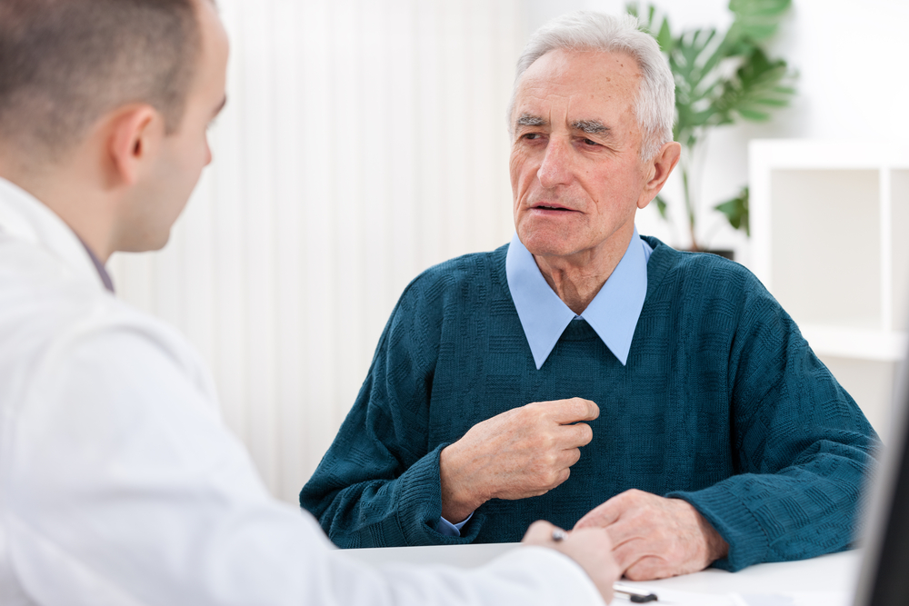 Older man talking to a doctor