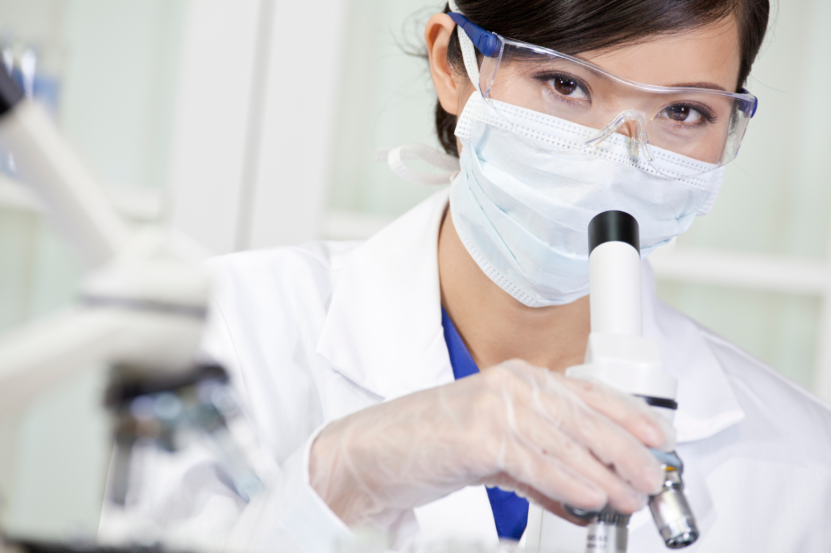 A researcher in a lab looking at samples.