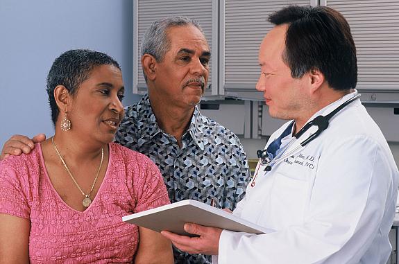 A couple consults with a doctor.