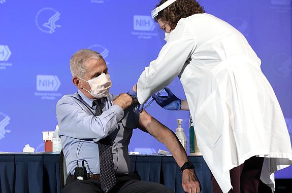 Dr. Anthony Fauci, Director of the National Institute of Allergy and Infectious Diseases, receives the Moderna COVID-19 vaccine at the HHS/NIH COVID-19 Vaccine Kick-Off event at NIH on 12/22/20.