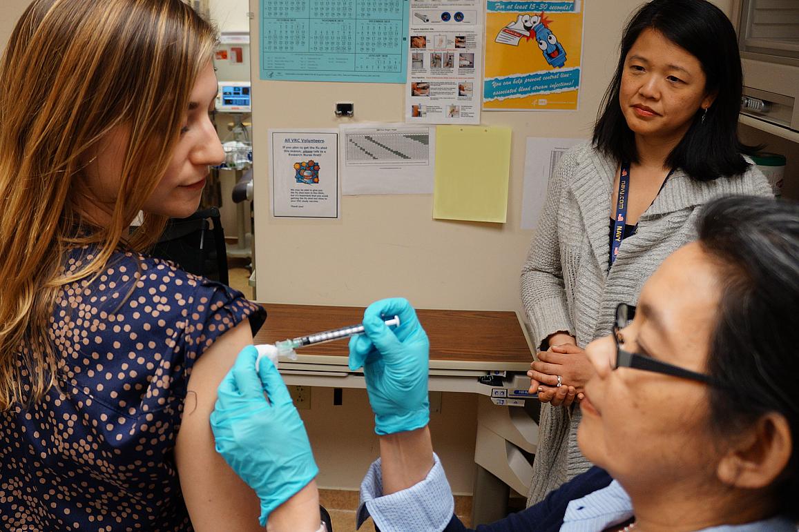 Image of a volunteer receiving a shot